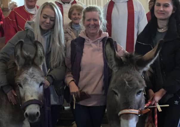 Palm Sunday celebrations with the donkeys Alice and Toad at the church