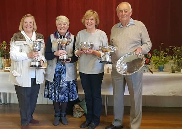 Winchelsea Spring Show 2019  Trophy winners.: John Dunk won the overall winners salver and the cup for flowers.  Jennifer Smith won the cup for floral art, Helen Macdonald the cup for pot plants, and Celia King the challenge bowl for cookery SUS-190417-091739001