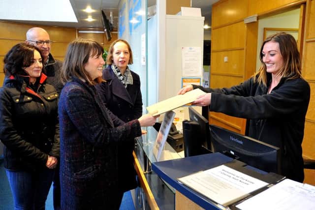 Lucy Holloway handing in her petition at the council offices earlier this year