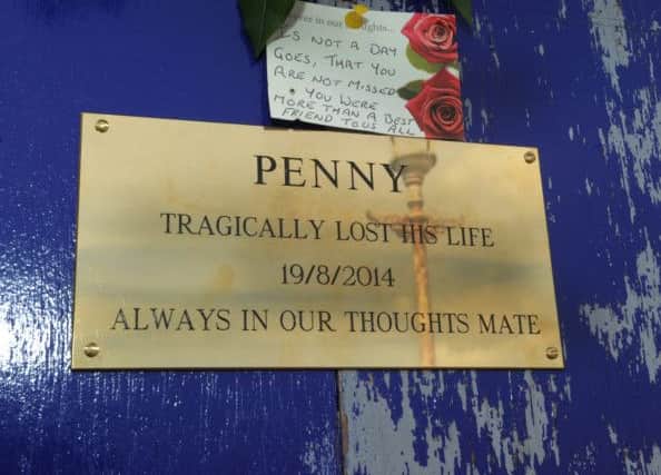 Floral tribute and plaque at Eastbourne Pier for Stephen Penrice (Pic by Jon Rigby) SUS-150819-200429008