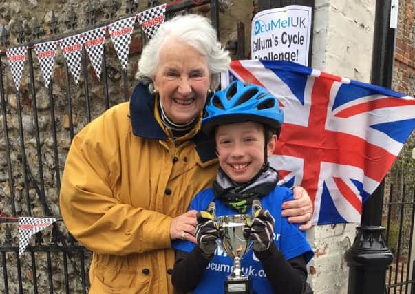 Callum Smith with his grandmother Sue Harris at the finish line in Angmering