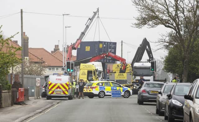Workers from Storage on Site battle to stabilise the stricken crane SUS-190417-153939001