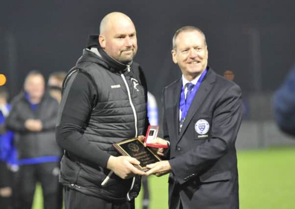 Hollington United manager Scott Price receives his awards after last night's final. Picture by Simon Newstead