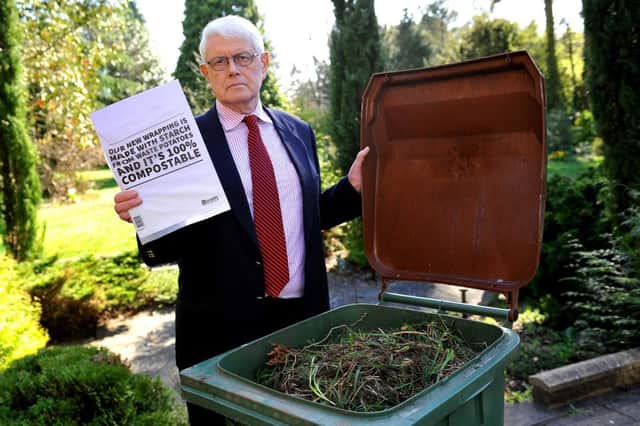Horsham councillor Philip Circus with one of the bioplastic bags which a West Sussex waste management firm says cannot be added to garden waste . Photo: Steve Robatrds SR1908166 SUS-190325-170316001
