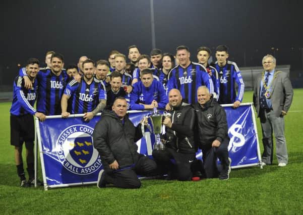 Hollington United celebrate after winning the Sussex Intermediate Challenge Cup alongside town mayor Cllr Nigel Sinden