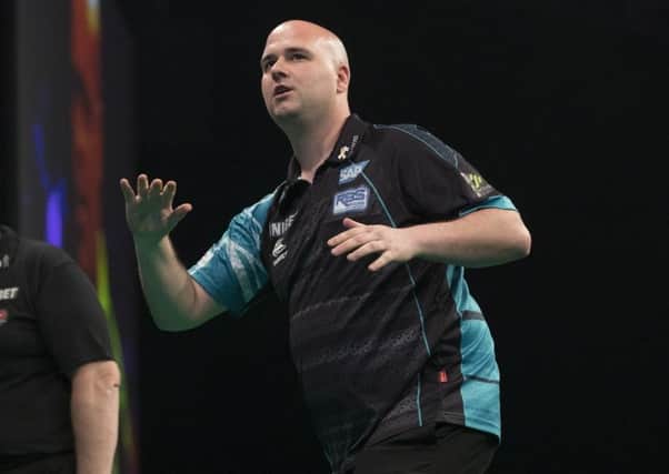 Rob Cross endured a disappointing night against Michael van Gerwen. Picture courtesy Lawrence Lustig/PDC