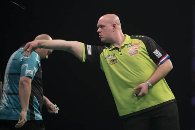 Michael van Gerwen at the oche against Rob Cross. Picture courtesy Lawrence Lustig/PDC
