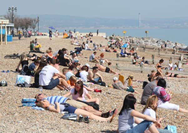 Beach-goers enjoying the sun in Worthing