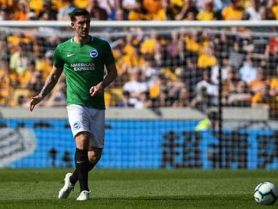 Lewis Dunk in action at Wolves. Picture by PW Sporting Photography