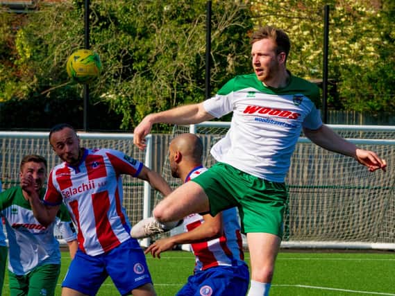 Jimmy Wild gets up well for Bognor at Dorking / Picture by Tommy McMillan