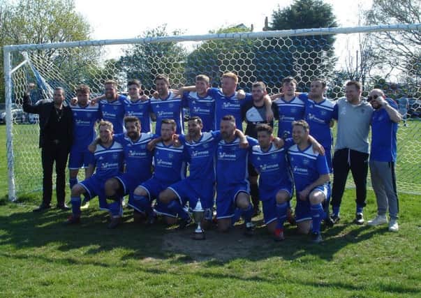 Sidley United celebrate after winning the East Sussex Football League Premier Division title