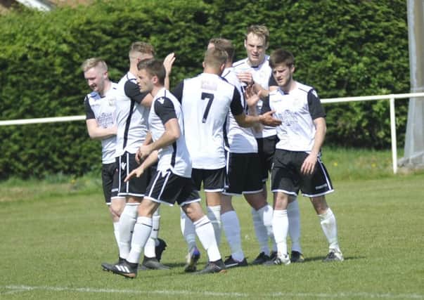 Bexhill United celebrate their second goal in the 2-0 win away to Hailsham Town. Picture by Simon Newstead