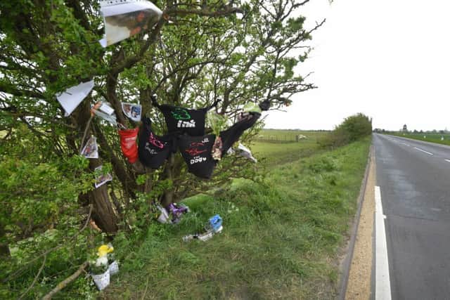 Floral tributes left at the scene of the collision