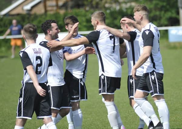 Bexhill United celebrate their opening goal in Easter Monday's 2-0 win away to Hailsham Town. Picture by Simon Newstead