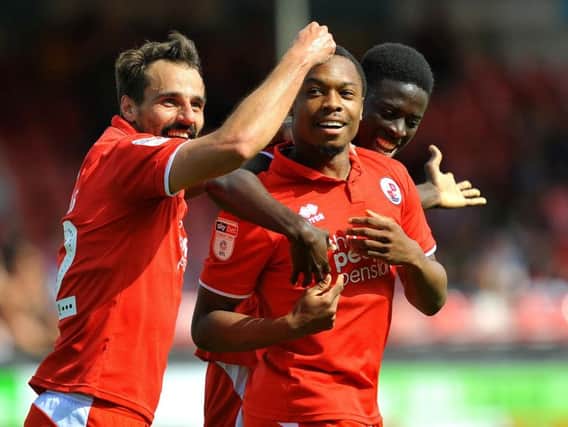 Crawley Town's Filipe Morais congratulates Ashley Nathaniel-George for his goal during Reds' 1-1 draw with Notts County on Bank Holiday Monday. Picture by Steve Robards