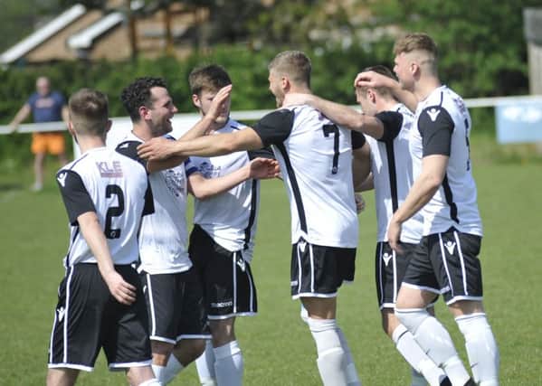 Bexhill United celebrate their opening goal against Hailsham Town