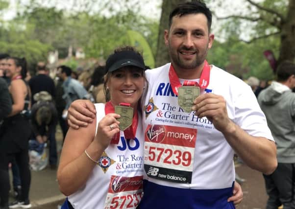 Joanna and Rikky with their London Marathon medals