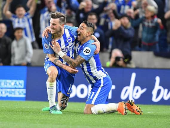 Pascal Gross and Anthony Knockaert celebrate the winning goal against Manchester United last season. Picture by PW Sporting Photography