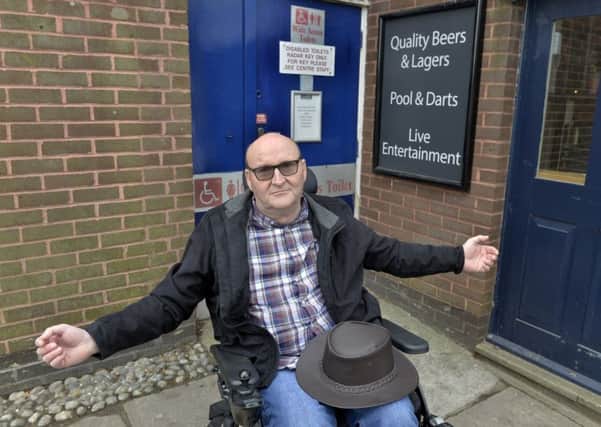Ian Westgate who is unhappy that the refurbishment of Langney shopping centre in Eastbourne does not include a disabled toilet (Photo by Jon Rigby) SUS-190404-093727008