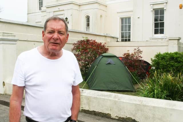 Robin Biggs is not happy about the tents outside Beach House. Picture: Derek Martin