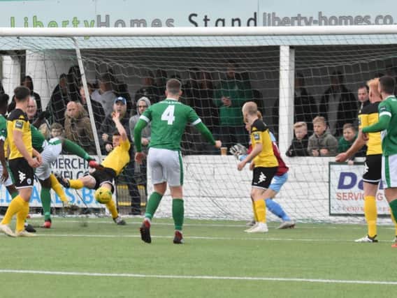 Allesandro Nanni blocks the ball on the line. Haywards Heath Town v Ashford United. Picture by Grahame Lehkyj