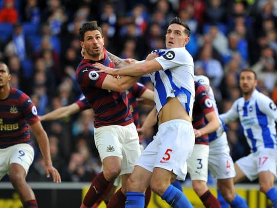 Lewis Dunk battles away against Newcastle. Picture by Steve Robards