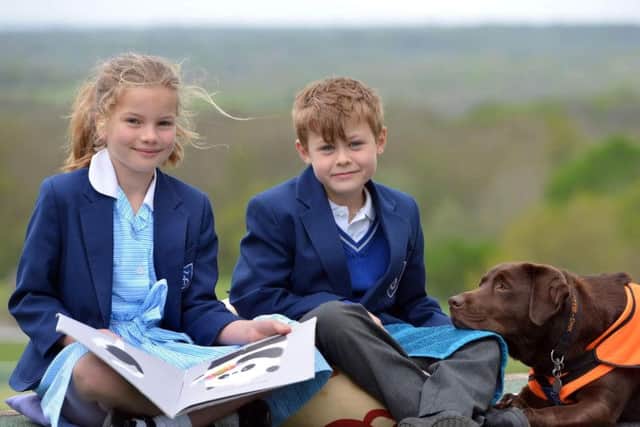 Educational assistance dog Lottie, aged three, with Skippers Hill Manor Preparatory pupils. Photograph: Peter Cripps/ 24-4-19 (09)