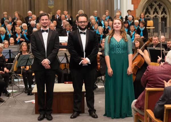 Soloists (L to R) Meilir Jones (bass), Peter Harris (tenor) and Catriona Holsgrove (soprano), pictured with Burgess Hill Choral Society, 27 April 2019. Photo copyright  Laurence Leng