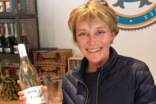 Alison Nightingale with the first bottle of Bacchus Frizzante 2018 at the Albourne Estate