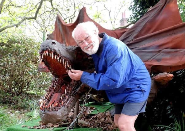 Colin Smith posing with his dragon