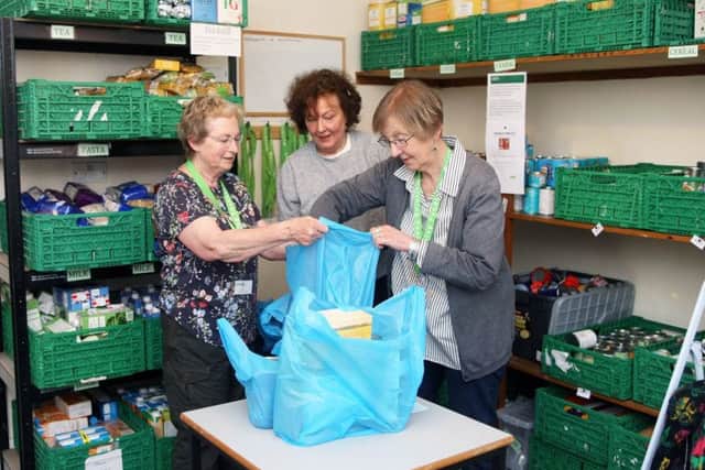 Worthing Foodbank volunteers, from left, Ann Healey, Sylvie Tye and Concheta Canute. Photo by Derek Martin DM1942538a