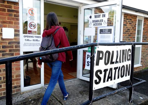 A voter attends a Burgess Hill polling station