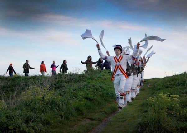 Dancing at Dawn, West Hill, Hastings. Photo by Kevin Boorman.

Three local sides, Mad Jacks Men, Mad Jacks Women, and Hannahs Cat, followed the tradition of dancing at dawn on May Day, on Ladies Parlour, against the historic backdrop of Hastings Castle. Starting at 0500, each side performed a number of dances, with the event finishing with a mass dance around the perimeter of Ladies Parlour. SUS-180105-085138001