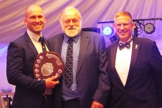 Roger Roberts receives the David Northen Trophy from Roy Wake and Jerry Hohenkerk. Picture courtesy Peter Knight