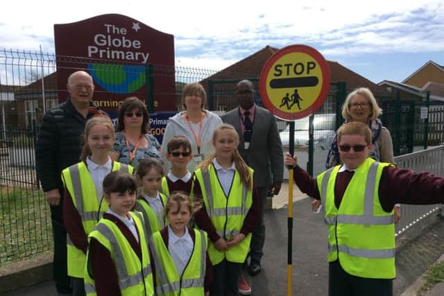 Councillors, staff and pupils at the Globe Primary School call for a new pedestrian crossing