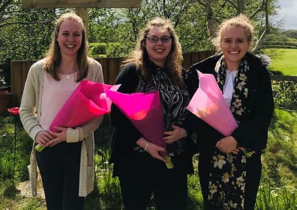 Chichester University teacher training students Jessica, Charlotte and Lauren who gave Ashington CE Primary School's prayer garden a new lease of life SUS-190105-140011001