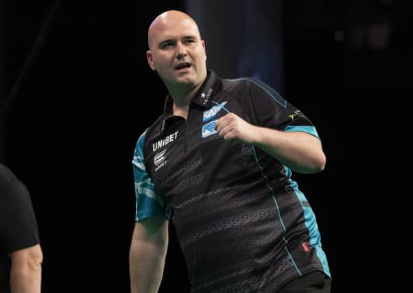 Rob Cross celebrates during his 8-1 win against Michael Smith. Picture courtesy Lawrence Lustig/PDC