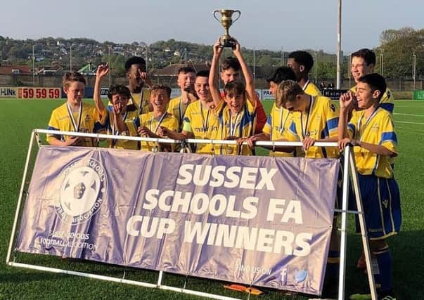 The Claremont School under-13 boys' team celebrates after winning the Sussex Schools' County Cup