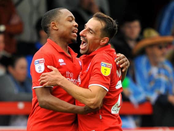 Scorers Ashley Nathaniel-George and Filipe Morais celebrate a Crawley Town goal against Tranmere Rovers.
Picture by Steve Robards