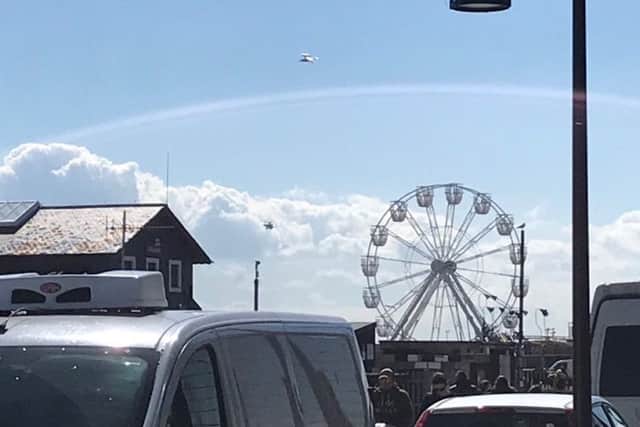 The coastguard helicopter flying over Hastings seafront yesterday (May 4). Picture: Daniel Burton
