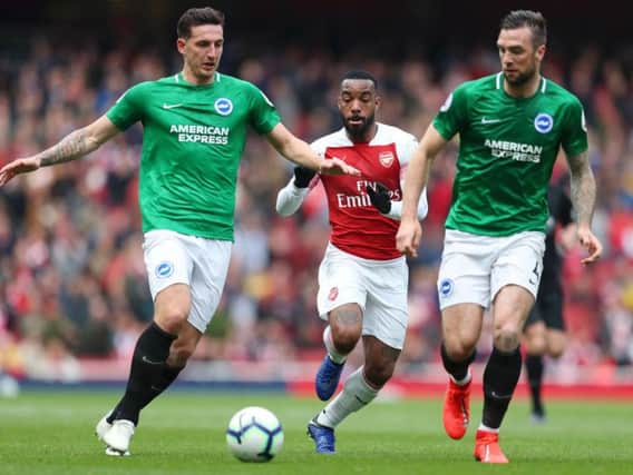 Lewis Dunk in action at Arsenal. Picture by Getty Images