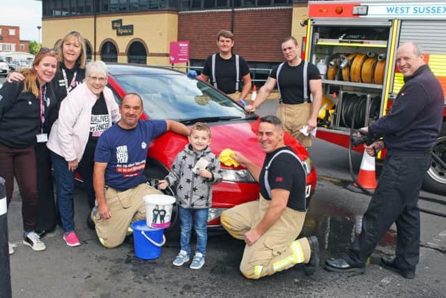 Littlehampton firefighters with Morrisons community champion Alison Whitburn and CLIC Sargent supporters. Photo by Derek Martin DM1951761a
