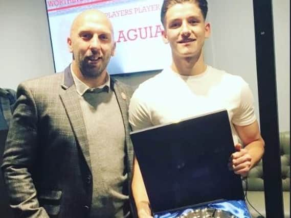 Ricky Aguiar (right) receives one of his awards from Adam Hinshelwood