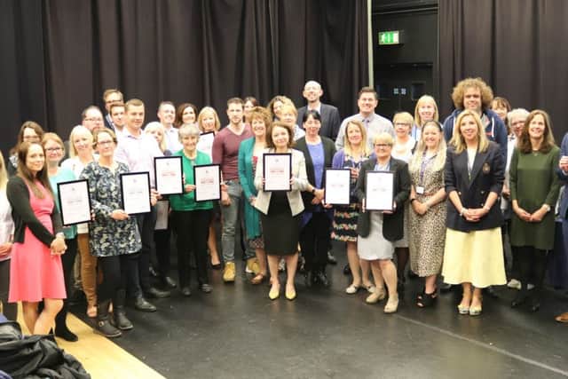 The award-winning schools with their certificates