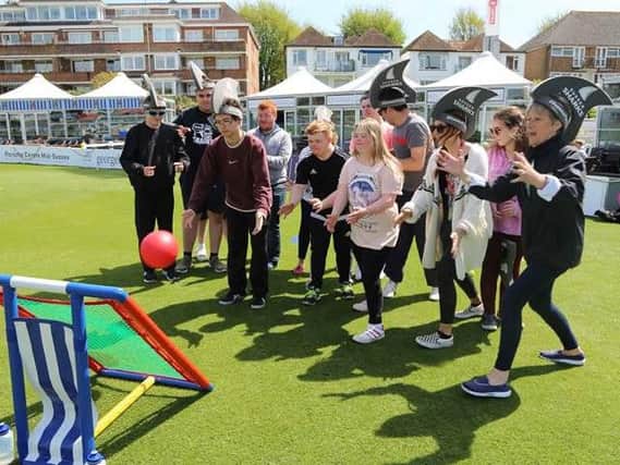 Participants and volunteers play on The 1st Central County Ground pitch at last years DIScoverABILITY Day (Credit: Sussex Cricket)