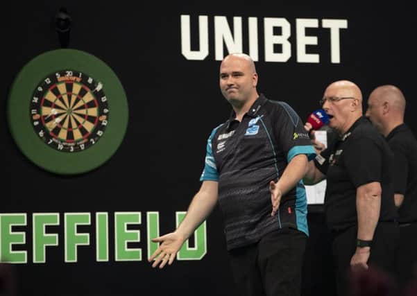 Rob Cross celebrates after completing his 8-4 win over Mensur Suljovic. Picture courtesy Lawrence Lustig/PDC