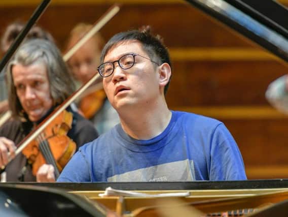 Picture by Andrew Mardell: Yi-Yang Chen in rehearsal with WSO.