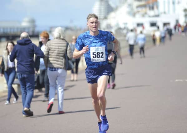 Adam Clarke on his way to a course record time in the 2019 Hastings Runners 5 Mile Race this morning. Picture by Simon Newstead