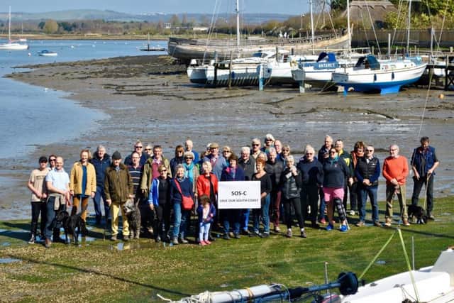 Libby Alexander from SOS-C, centre, with John Nelson, chairman of Chichester Harbour Trust, and concerned residents at Dell Quay for the launch of SOS-C