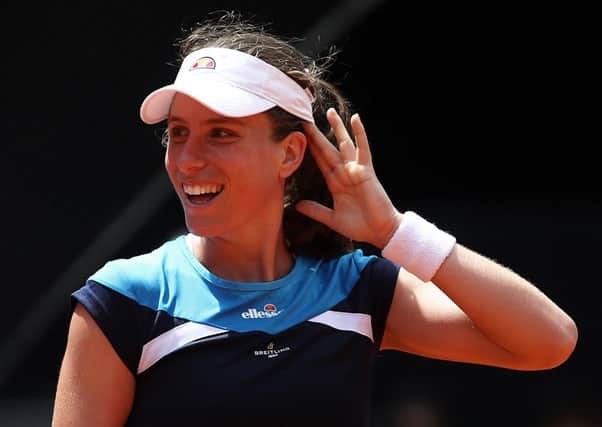 MADRID, SPAIN - MAY 07:  Johanna Konta of Great Britain reacts against Simona Halep of Romania during day four of the Mutua Madrid Open at La Caja Magica on May 07, 2019 in Madrid, Spain. (Photo by Julian Finney/Getty Images) SUS-190514-112527002